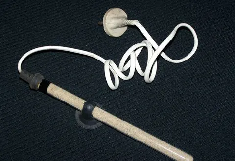 A glass aquarium heater with suction cups
